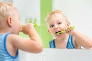 Baby boy brushing his teeth