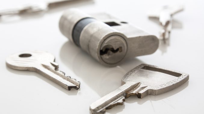 lock and keys on a white table lock and keys on a white table