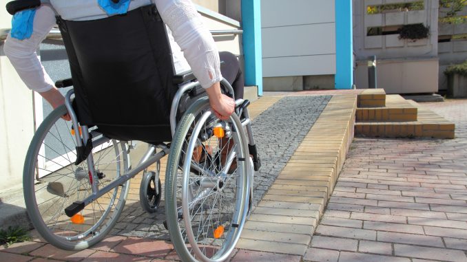 Man in a Wheelchair on a Ramp Man in a Wheelchair on a Ramp