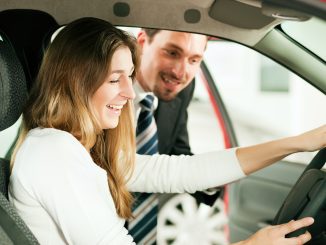 Car maintenance guy talking to the owner