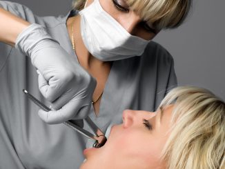 Dentist examining the teeth
