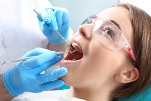 Woman getting dental implant procedure
