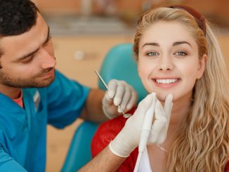Woman getting her teeth checked