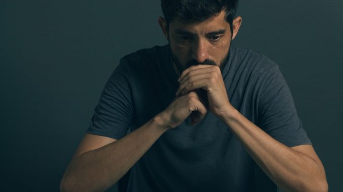 a sad man thinking deeply a sad man thinking deeply