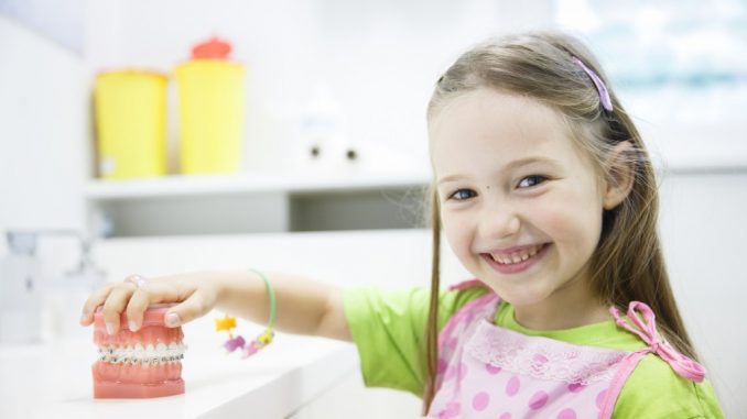 Smiling girl at dentist's office Smiling girl at dentist's office