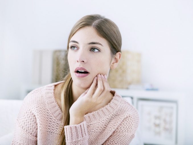 Woman suffering from toothache