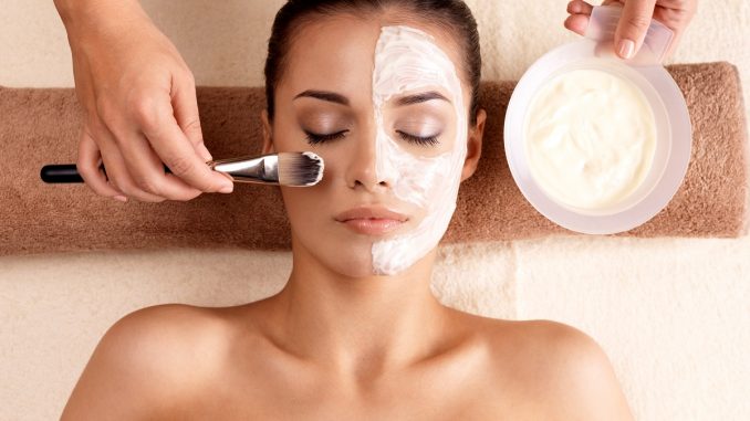 Woman in a spa for a facial treatment Woman in a spa for a facial treatment