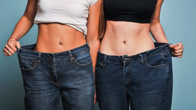 Women showing off their old pants Women showing off their old pants