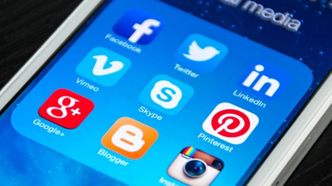 Smartphone showing social media apps Smartphone showing social media apps