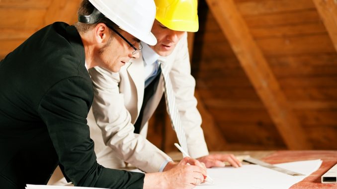 two construction workers two construction workers