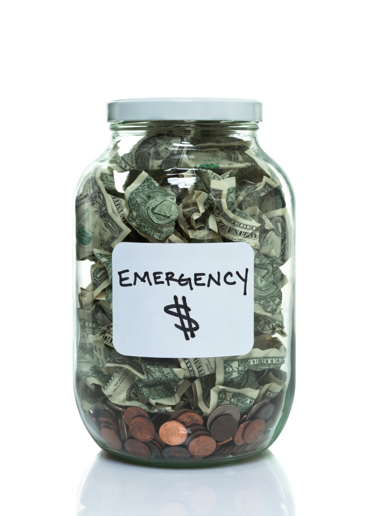 A jar full of money with label of emergency 