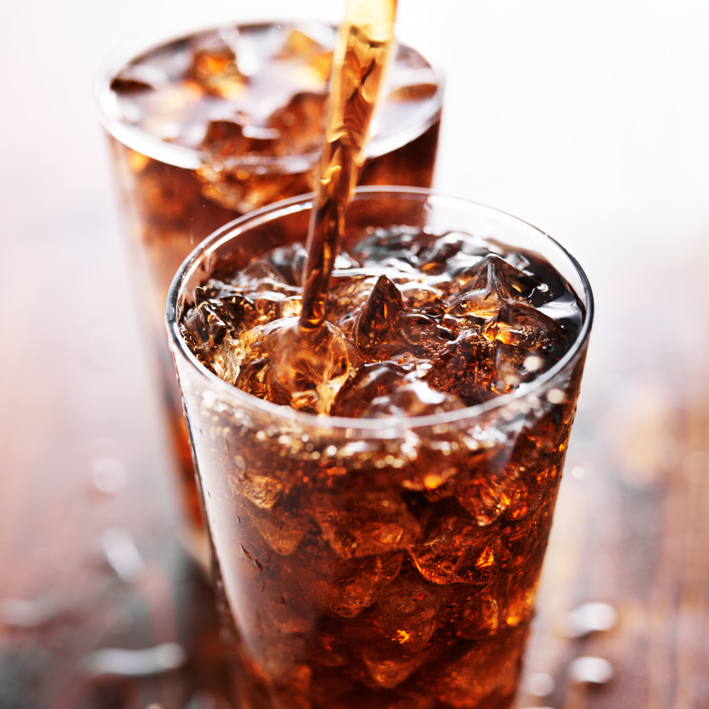 soda being poured into glass top view