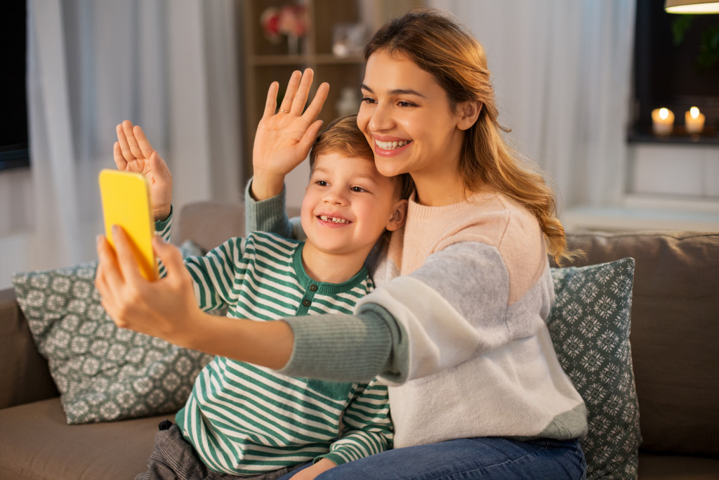 family concept, mom and son calling virtually