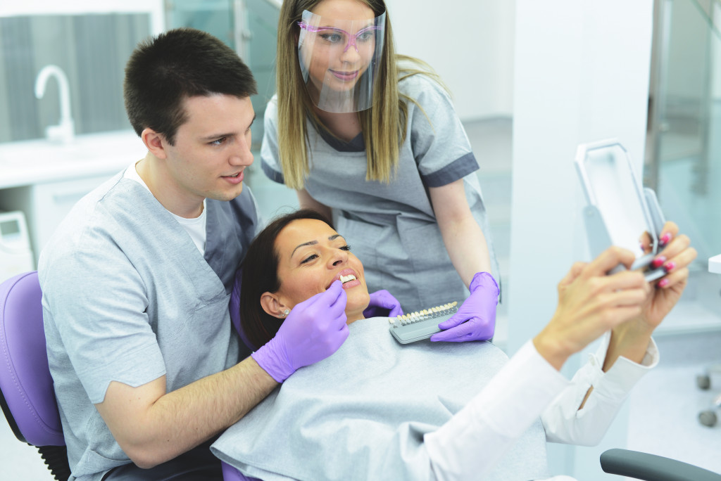 a patient getting a dental implant from dentist